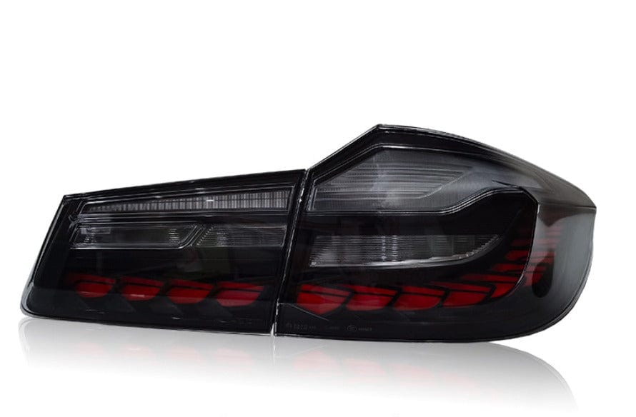 Close-up of smoked OLED LED tail light design on BMW M5 F90